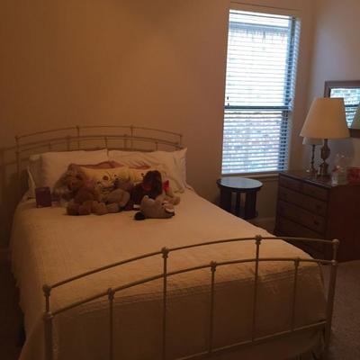 Brass bed has both headboard and back broard
