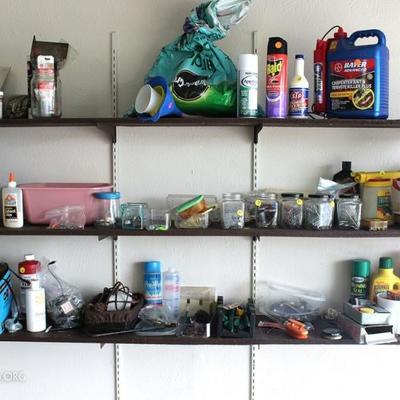 Three shelfs of miscellaneous garage items
