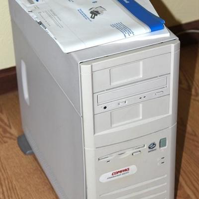 Old compaq computer tower, hard drive has been removed
