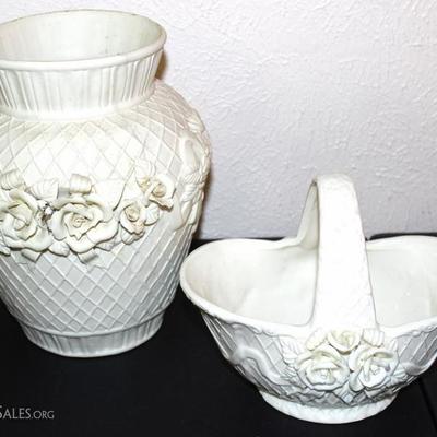 Two white porcelain bases with rose dÃ©cor motif
