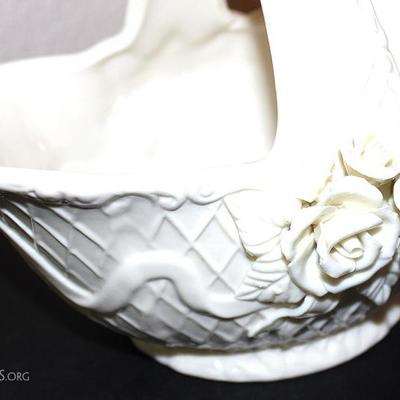 Two white porcelain bases with rose dÃ©cor motif
