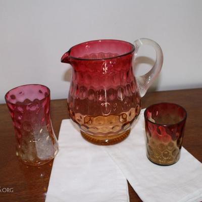 cranberry victorian water pitcher and two vase/ glasses.