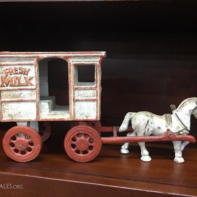 Antique cast iron horse and milk cart