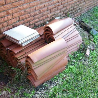 Lot of vintage terracotta rounded roof tiles - these cost a fortune at the salvage places!