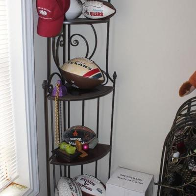 corner shelf lots of sports memorabilia