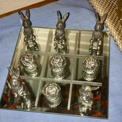 Pewter rabbit and cabbage tic tac toe game on mirrored base