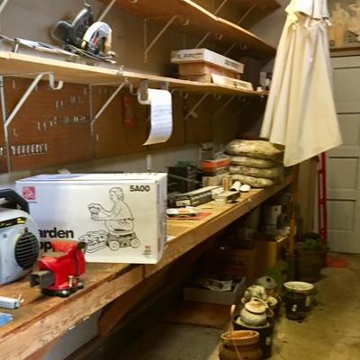 Garage tools and cleaners plus canvas patio umbrella