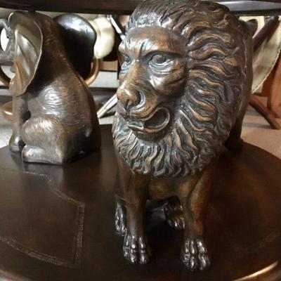 Wood carved safari figures with glass top coffee table
