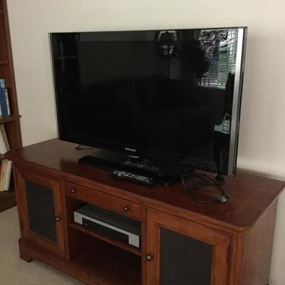 Super nice tv stand solid wood and the TV is available too 
