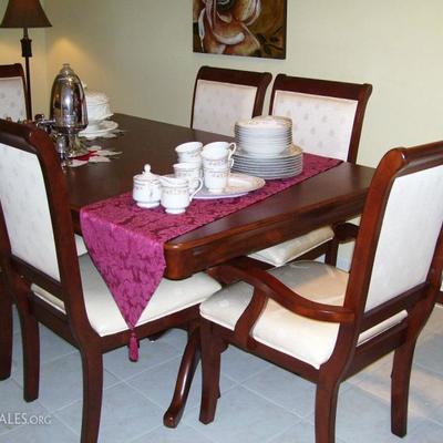 Lovely dining room set with two leaves and 8 chairs - like new - plastic has never been removed from chairs