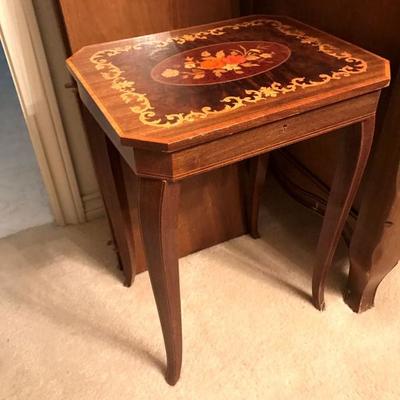 One of three small inlaid musical tables