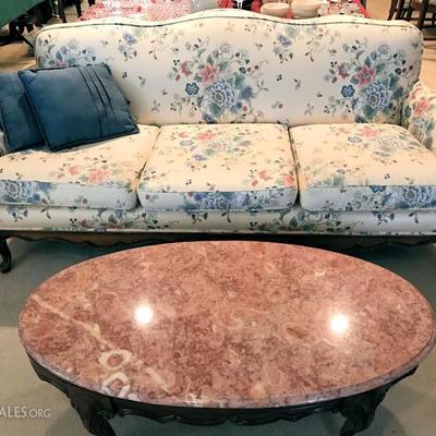 Custom upholstered couch and Portuguese marble top table