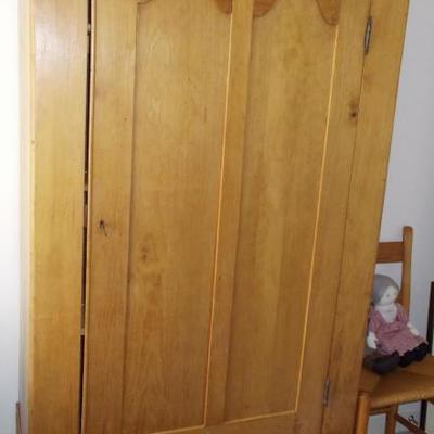 Maple armoire single door with flush panes having arched tops. drawer in base $550
73 1/2 X 35