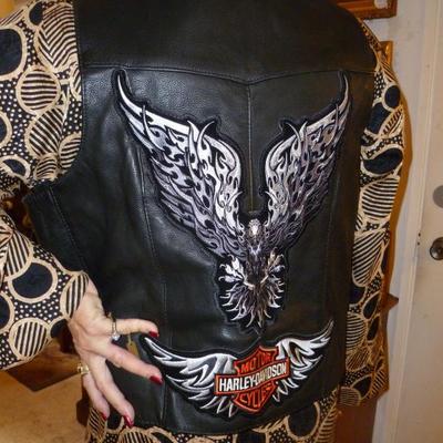 Harley Davison leather vest and Harley Diamond ring.