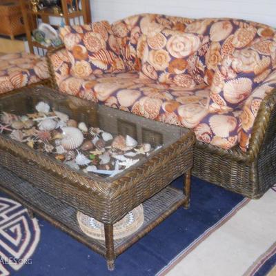 wicker sofa, ottoman, display coffee table w/shells, rug, etc.