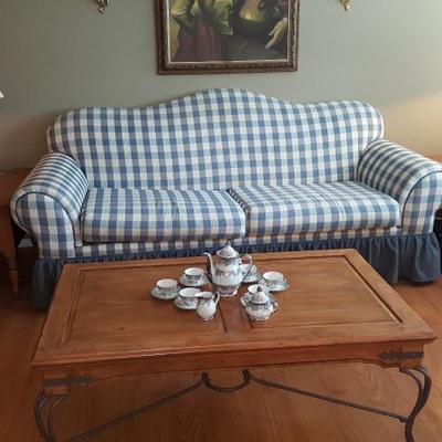 Sofa with wooden coffee table and Bavarian tea set