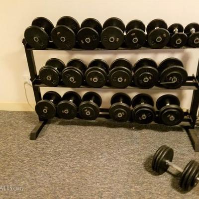 Extensive Collection of Dumbbells. Prostyle. 2 of each . 5 pounds to 85 pounds with racks. See both photos. 