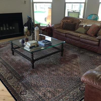 Area rug, Leather sofa, glass coffee table