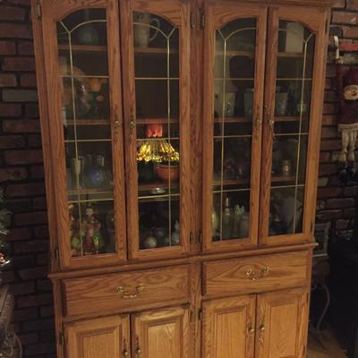 Pair of narrow matching curio cabinets