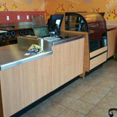 Three sections of metal front counter with stainless steel top. Two sections have drawers and measur