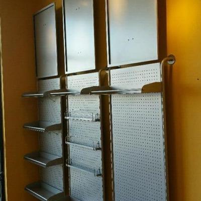 three sections of brushed nickel wall display Â 
