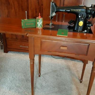1947 Singer Model 201-2 with accessories and cabinet. Works well and is in great condition.