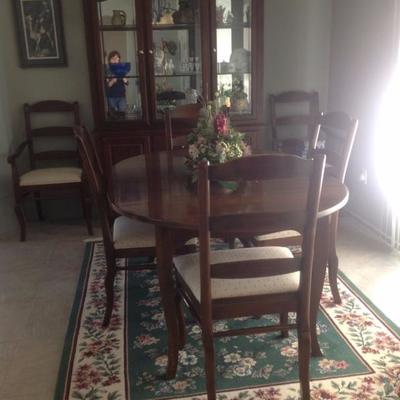 Table has 2 leaves and table pads, 6 chairs and matching china cabinet