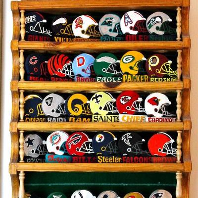 NFL team helmets, hand cut wood & hand painted, in display rack, made by the homeowners