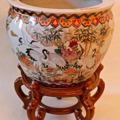 variety of Chinese pots/planters on wood stands