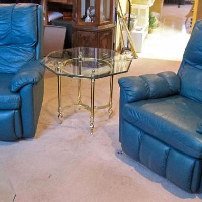 pair of teal leather recliners & glass and brass end table