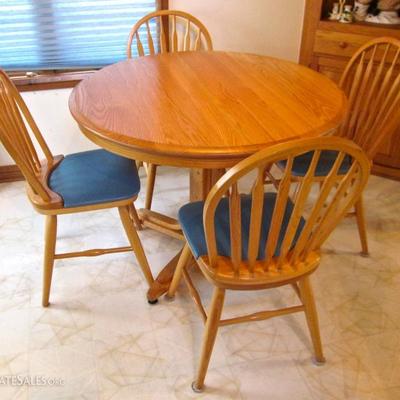 oak table by Dinaire, Buffalo, NY - round with two leaves + 4 Windsor style chairs with upholstered seats