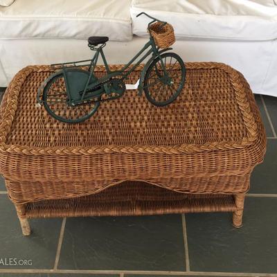 wicker coffee table and bicycle decor