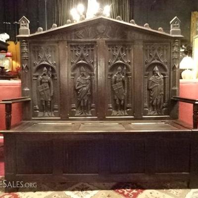 19TH CENTURY GOTHIC REVIVAL OAK BENCH WITH STORAGE SEAT AND CARVED KNIGHTS