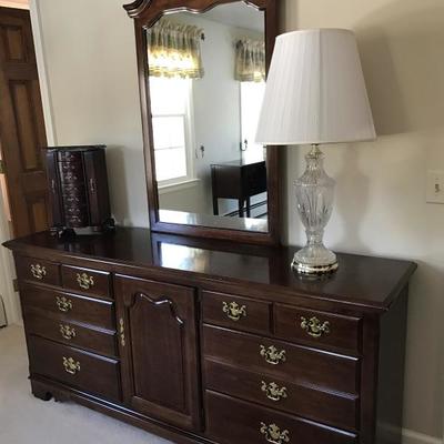 3 piece bedroom set in gorgeous cherry wood including queen bed. Long dresser with mirror is 69