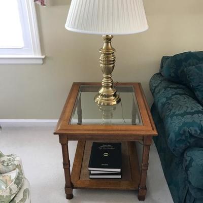 Wood and glass end table, $60. Sold with matching end table and coffee table as a set for $275. Measures 21