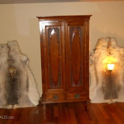 HAND CARVED WINE CABINET VERY ORNATE IN CARVING  REAL WOLF FUR OR HIDE 5FT TALL WITH SCONCES ON THEM VERY EXOTIC