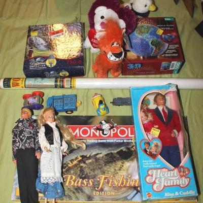 Box lot of children's toys including vintage Ken and Barbie dolls and a World Map.
