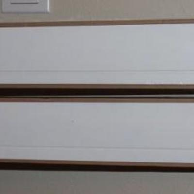 Pair of white floating shelves new in the box with a plate rack groove
