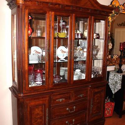 Breakfront cabinet with many collectibles
