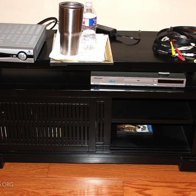 TV stand with electrical components. DVD player CD player