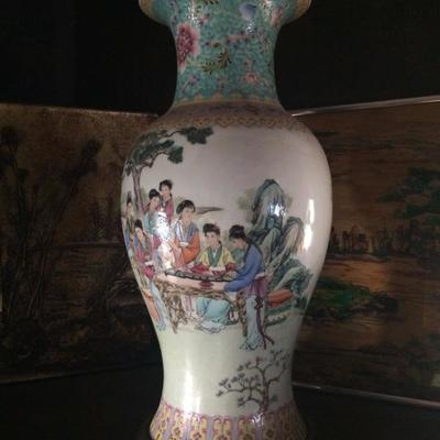 Close shot of large Chinese vase with garden scene