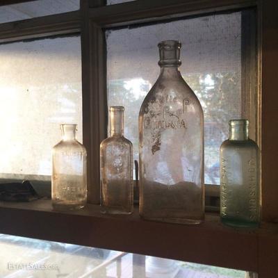 Very small peek at a collection of antique apothecary / advertising bottles (some color glass)