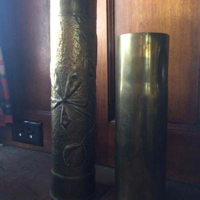 Pair of WWI era brass shell casing vases (one plain, one with floral design)