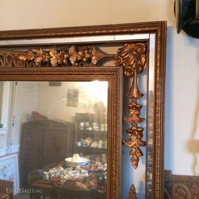 Detail of ornate gilt mirror frame