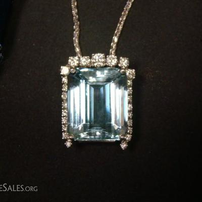 Ladies custom made 14 kt. white gold aquamarine and diamond pendant containing (1) Emerald cut aquamarine measuring 20.5 mm x 17 mm x...