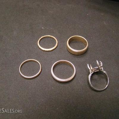 5 rings.  (1) 10 kt. women's ring - about 1 gram.  (2) 14 kt. men's ring - about 3 grams.  (3) 14 kt. men's ring - about 5 grams.  (4) 14...