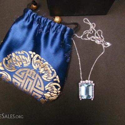 Ladies custom made 14 kt. white gold aquamarine and diamond pendant containing (1) Emerald cut aquamarine measuring 20.5 mm x 17 mm x...