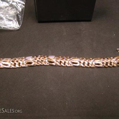 Ladies 14 kt. yellow gold bracelet, 15 mm in width, 7 inches in length, each section contains (2) rows of curb links, (6) curb links...