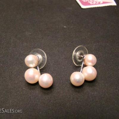 Ladies pearl stud earring.  Each ear ring has 3 pearls, approximately 7 mm each.  