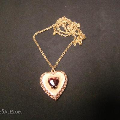 Ladies heart shaped locket.  Heart shaped Amethyst center stone.  Back of locket is engraved, 